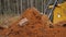 Crawler bulldozer levels ground, blade of heavy grader rakes soil close up