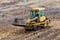 Crawler bulldozer standing on a hill