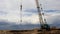 Crawler crane and storm clouds