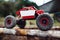 Crawler driving on wooden beams side view