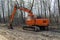 Crawler excavator evens sand