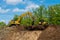 crawler excavator front view digging on demolition site