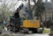 A crawler excavator loads dirt onto a dump truck in Chicago