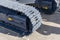 Crawler excavator track shoe. Close-up of tractor tracks. Chassis of the crawler excavator. New construction equipment