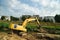 Crawler excavator working on riverbed site