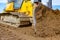 Crawler`s tracks, bulldozer machine is leveling construction site