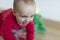 Crawling baby in Santa`s dress