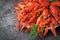 Crayfish. Red boiled crawfishes on table in rustic style, closeup.