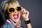 Crazy blond woman in sunglasses