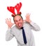 Crazy businessman with rudolph reindeer attire.