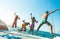 Crazy friends jumping off the boat into the ocean - Young happy people having fun diving into the sea - Travel, summer vacation,