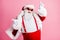 Crazy funky grey hair fat with big belly santa claus enjoy x-mas christmas party event want dance raise index finger