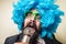 Crazy funny bearded man with blue wig