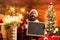 Crazy, funny Hipster Santa. New year Christmas concept. . Bearded man in Christmas sweater witd text board. Christmas
