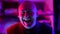 crazy man is laughing in nightclub, portrait in neon lights, mad smile and laugh