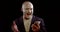 Crazy man with white greasepaint on face is laughing and typing on smartphone
