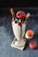 Crazy Milkshake with Chocolate Treats, Macaroons and Colorful Sw