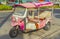 Crazy pink tuk tuk taxi in Don Mueang Bangkok Thailand