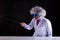 Crazy science teacher in white coat with unkempt hair in funny eye glasses