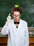 Crazy scientist with an apple on his head shows forefinger