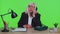 Crazy senior businesswoman talking on wired vintage telephone fooling making silly humor comic faces