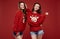 Crazy sisters best friends twins in fashion cozy winter sweater in studio
