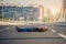 Crazy skateboarder lying down at the middle of a highway bridge