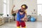 Crazy sports trainer holding dumbbell and clenching fist motivating you to exercise