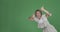 Crazy woman giving thumbs up gesture over green background