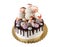 Cream cake with chocolate stains and meringue kisses, cake pops, isolated on white background.