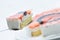 Cream cake on metal spoon, tart on white plate, cake with fruits and gelatin, patisserie, photography for shop, birthday cake
