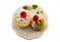 Cream cakes, kiwi and cherry on a white napkin