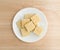 Cream cheese and chives crackers on a white plate