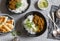 Cream coconut lentil curry with rice and naan bread - vegetarian lunch. Top view