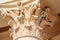 Cream color Italic Corinthian column capital fragment. Ancient architectural order building decor