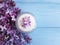 Cream cosmetic lilac aromatic table on a wooden background treatment