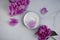 Cream cosmetic  moisturizer  natural  peony fresh  on a light background