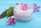 cream cosmetic moisturizing regeneration beauty magnolia flower on a wooden background