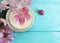 cream cosmetic moisturizing therapy regeneration product beauty magnolia flower on a wooden background