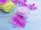 Cream cosmetic orchid flower  natural  cleanser spring  beautiful treatment on wooden background