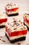 Cream fruit cake with red jelly and chocolate flakes