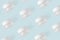 Cream in glass jars on pastel blue background. Beauty and skincare pattern or wallpaper. Cosmetic moisturizing care concept