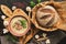 Cream of mushroom soup with homemade bread on a rustic background. Hot warming winter soup. Top view, flat lay