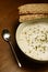 Cream of mushroom soup on a wooden table in autumn