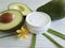 Cream oil cosmetic avocado care on treatment white wooden flower