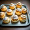Cream Puffs on oven tray.