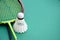Cream white badminton shuttlecock and racket