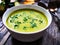 Cream zucchini soup on wooden table