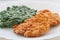 Creamed spinach and chicken schnitzel