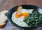 Creamed spinach with a fried egg in bowl